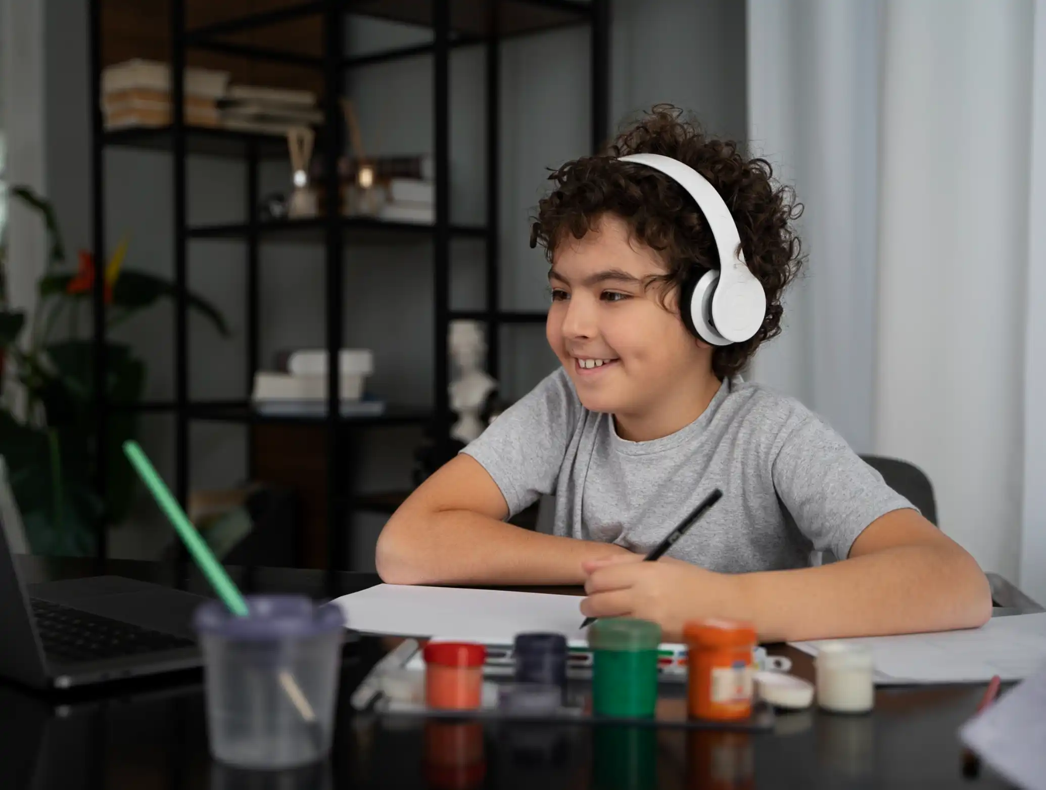 Young kid painting with watercolor