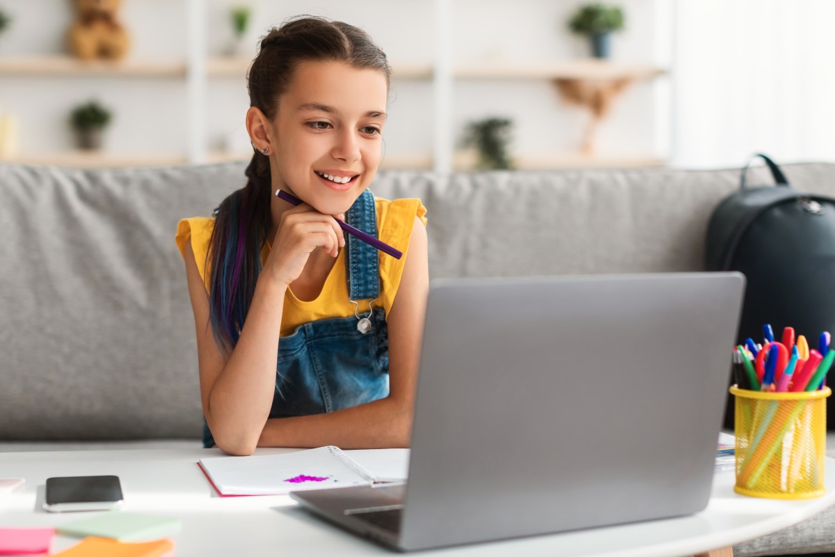 Girl using personal computer watching online webi 2023 11 27 05 12 24 utc (1)